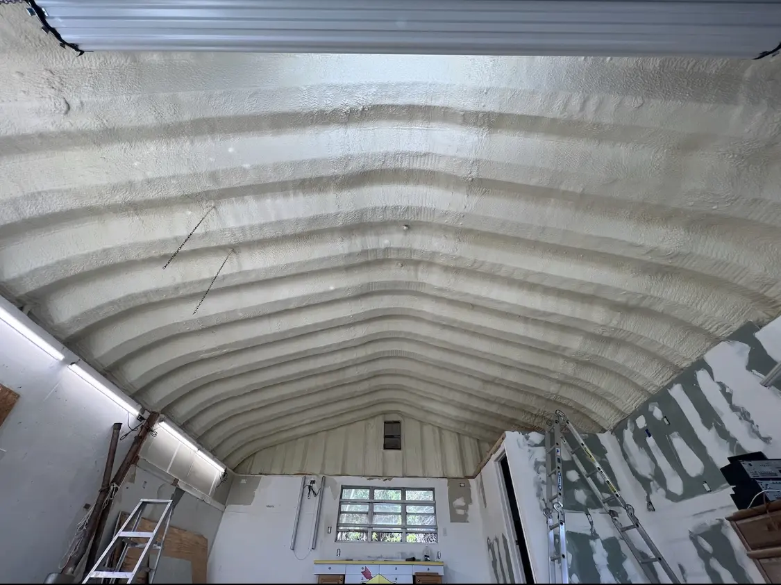 Spray polyurethane foam applied to the underside of a metal roof deck in Lake Shore